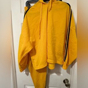 This is a matching yellow and black hoodie and sweat set, the size is 3x!